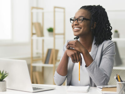 Business Career Concept. Afro Businesswoman Smiling Sitting In Modern Office. Copy Space